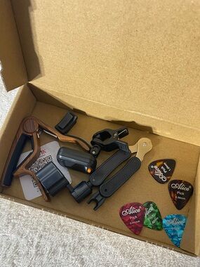5/$35 Essential 4-in-1 Guitar Accessory Kit (Capo, Tuner, String Winder, Picks)